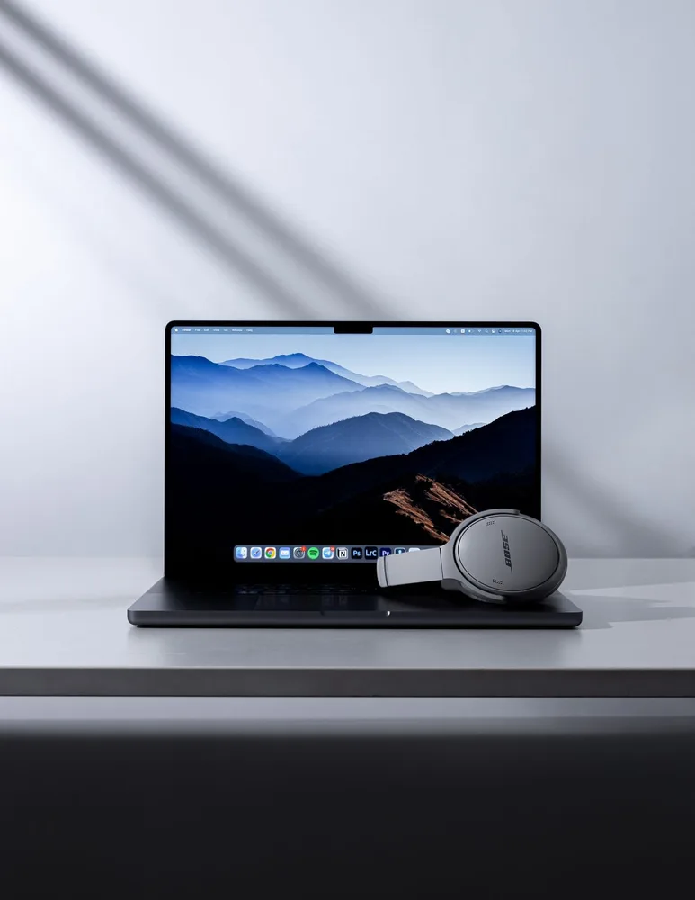 Laptop and headphones in a modern workspace